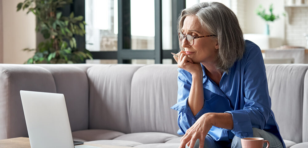 woman researching does insurance cover vein treatment in Maryland
