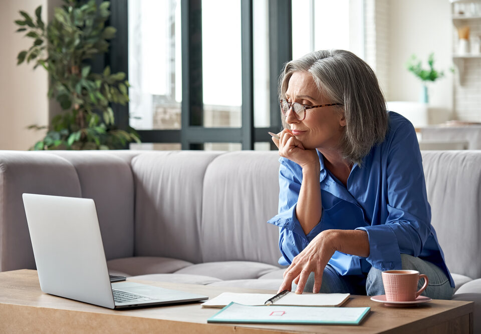 woman researching does insurance cover vein treatment in Maryland