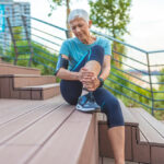 woman with leg cramps that signal vein disease in Maryland