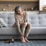 woman dealing with leg heaviness and fatigue in Maryland