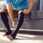 man using compression to prevent venous leg ulcers