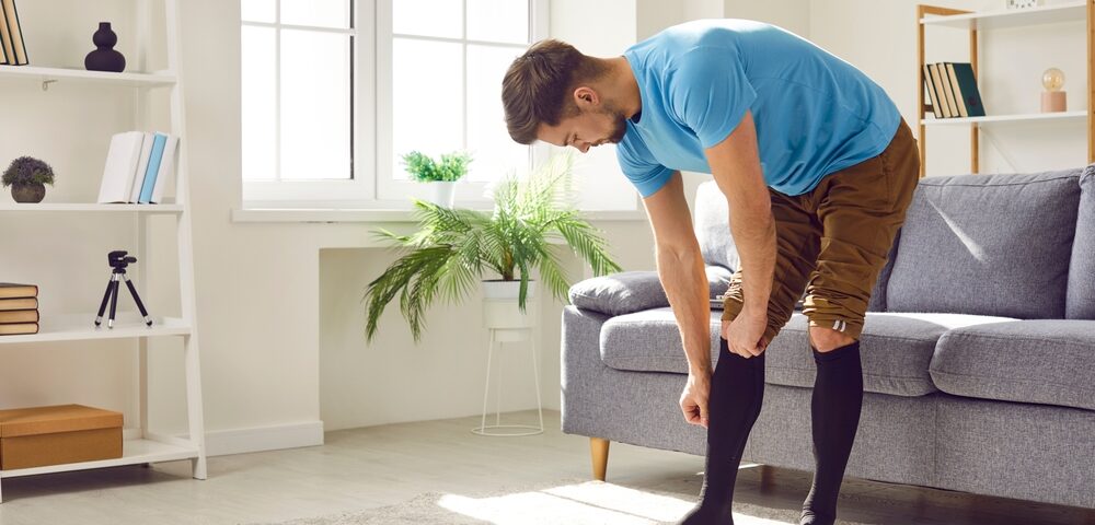 man wearing compression stockings for varicose veins in Bel Air MD