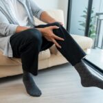 man with achy legs from varicose veins