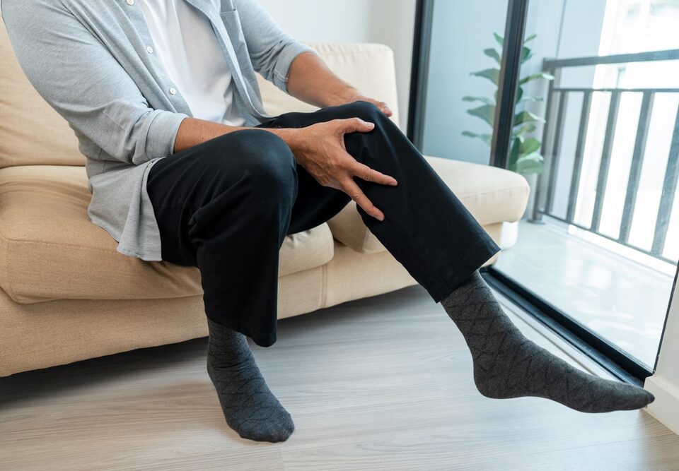 man with achy legs from varicose veins