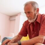 man researching if insurance will pay for varicose vein treatment in Maryland