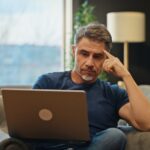 man deciding between spider veins and varicose veins