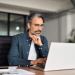 man looking up the cost of varicose vein treatments in Maryland