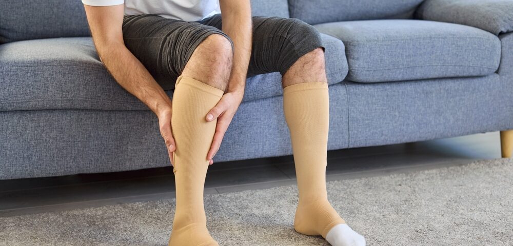 man doing compression therapy for recovery after Varicose Vein Treatment