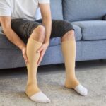 man doing compression therapy for recovery after Varicose Vein Treatment