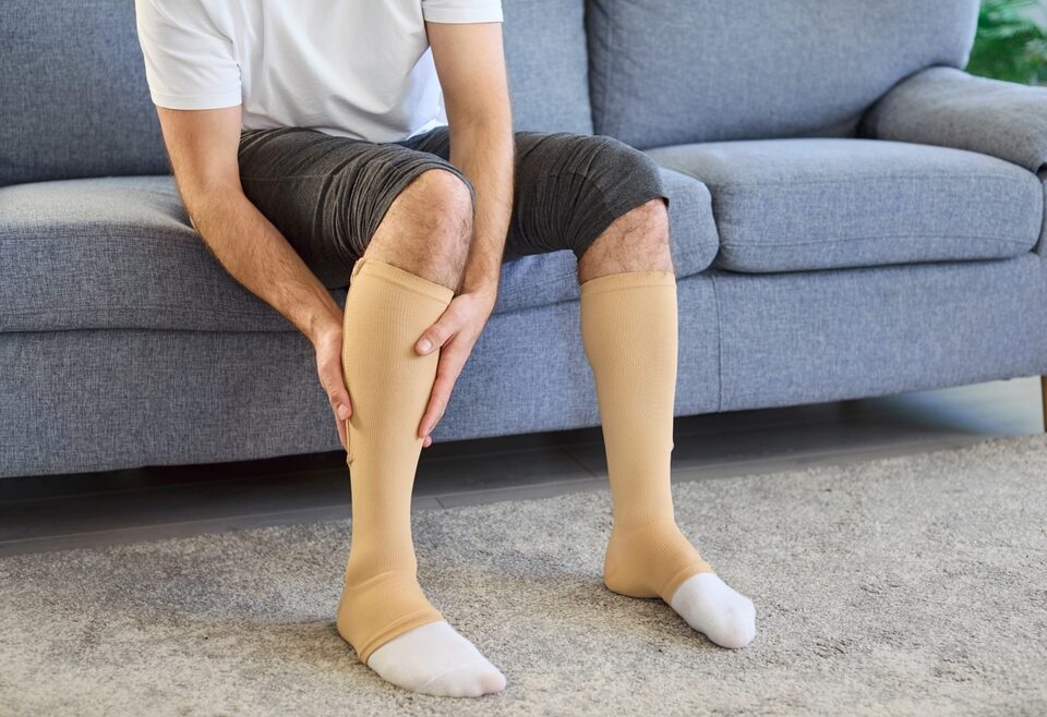 man doing compression therapy for recovery after Varicose Vein Treatment